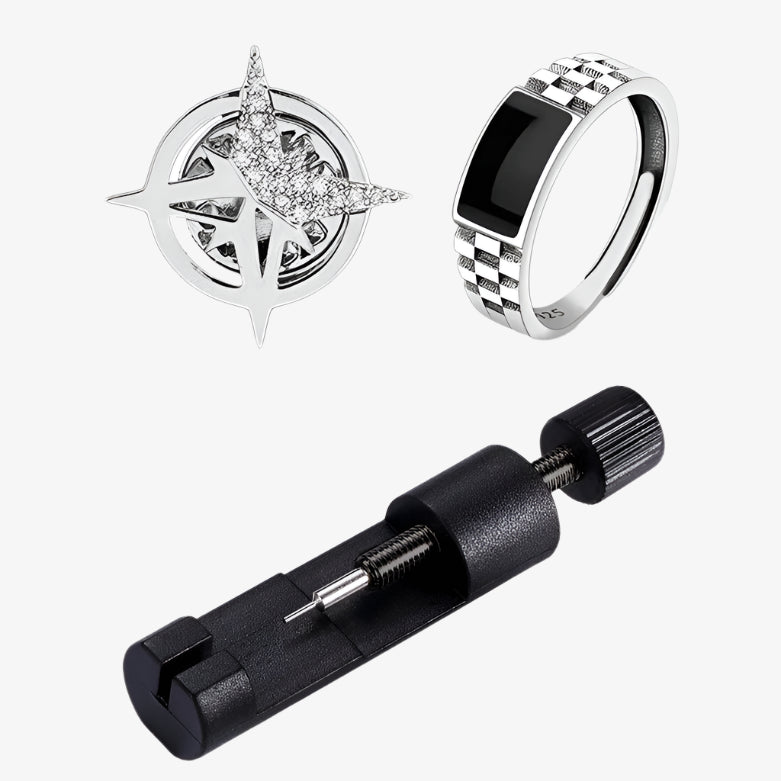 Black watch, ring, and pen with packaging on a white background