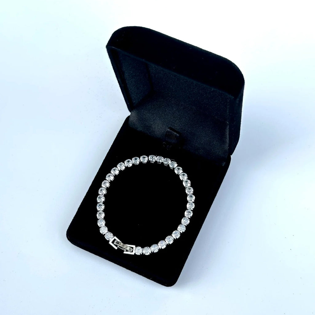Silver bracelet in a black jewelry box on a white background