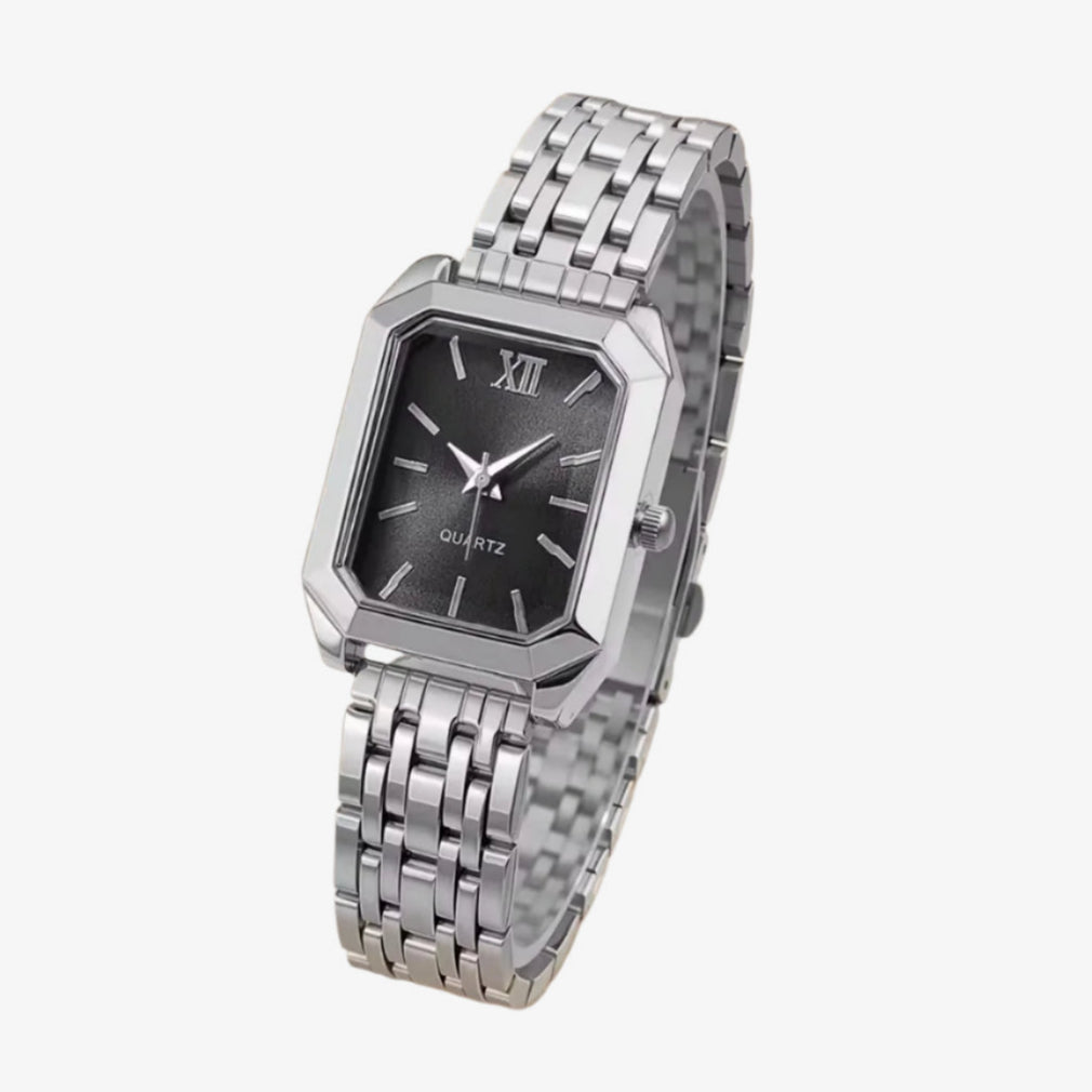 Silver watch with a black face on a white background