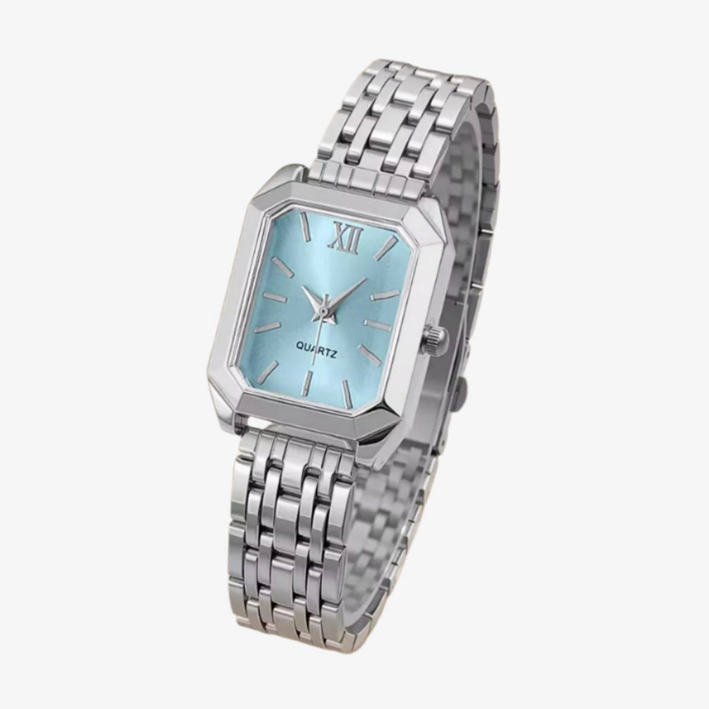 Silver watch with a light blue face on a white background