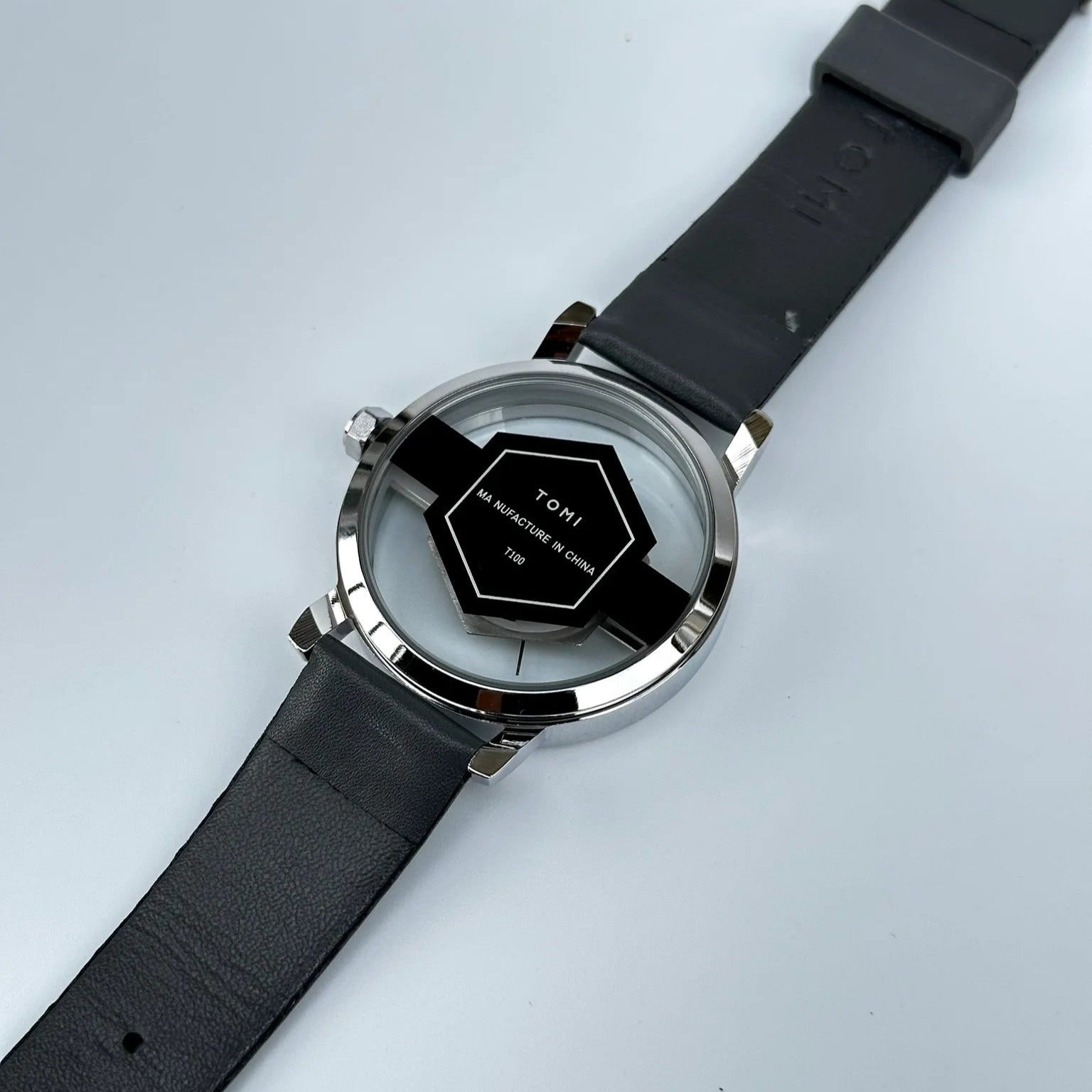 Smartwatch with black strap on a light gray background