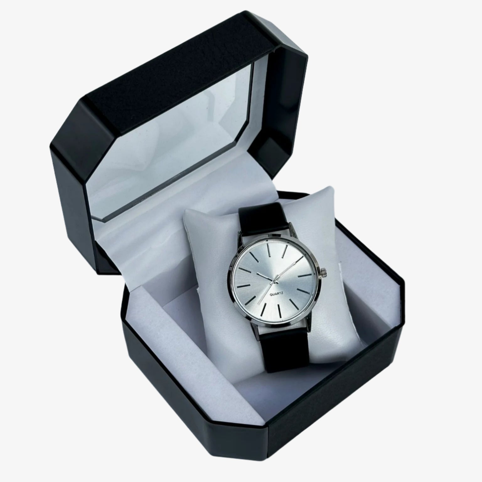 Watch in a black and white box on a light gray background