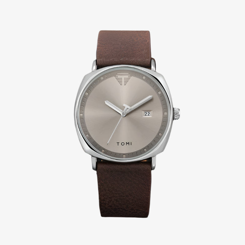 Watch with brown leather strap and silver case on a dark background